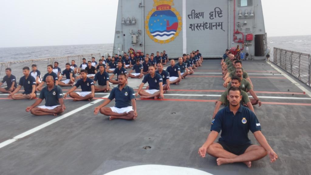 Protector of nation performing yoga asana on Board INS Sunayna (At Sea)