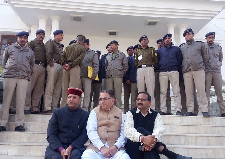 Suspended BJP lawmakers, Suresh Bharadwaj, Rajiv Bindal and Randhir Sharma, sitting on the stairs of Vidhan Sabha gate after they were denied entry to the Assembly